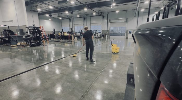 Blues Corporations commercial cleaning of a showroom floor, Quad Cities