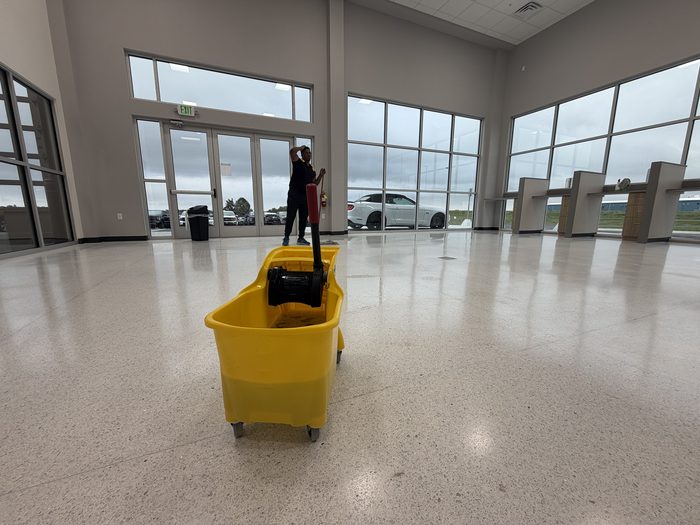 Blues Corporations janitorial floor cleaning at a Quad Cities commercial showroom